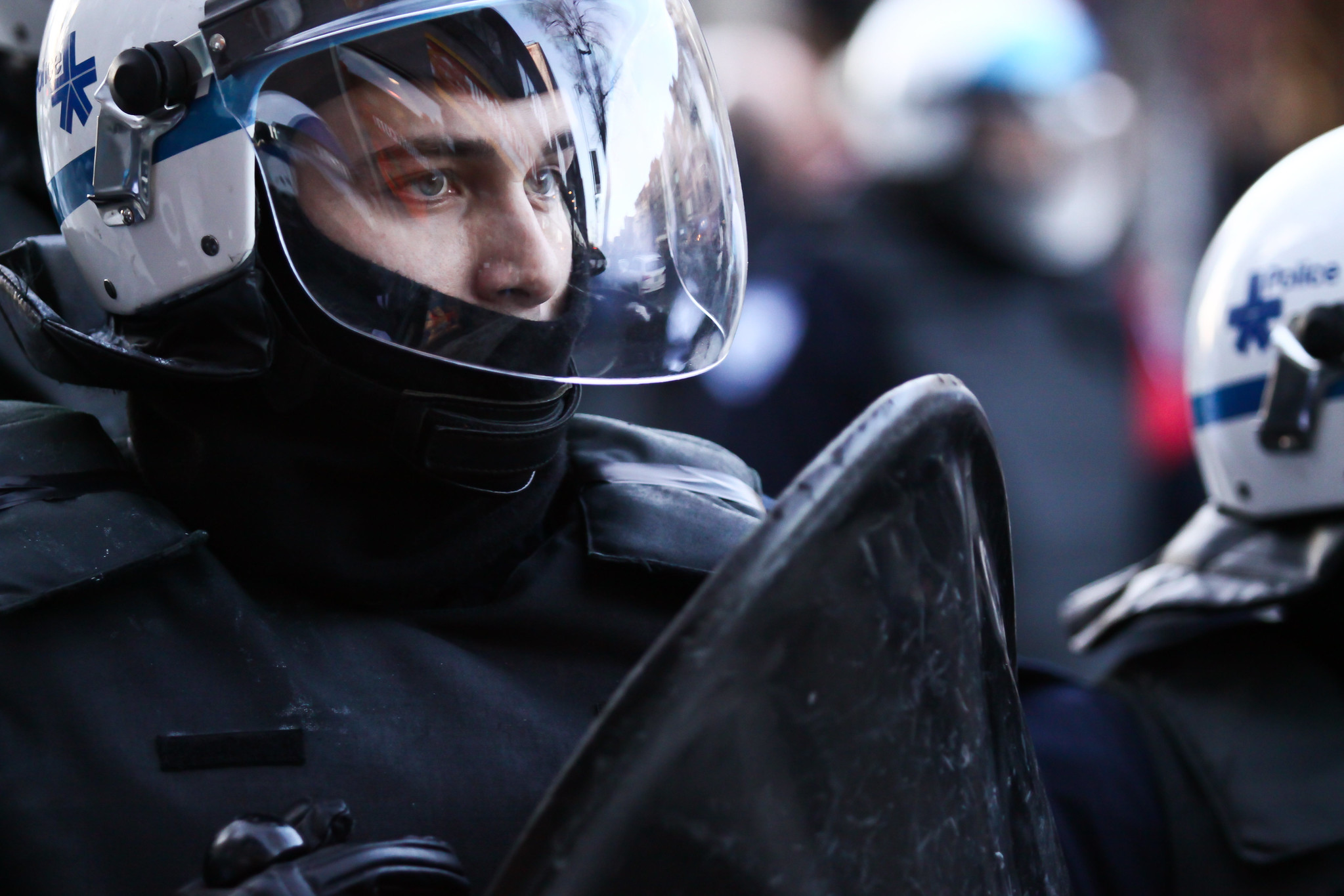 Close up of police officer at a police brutality protest in Montreal.